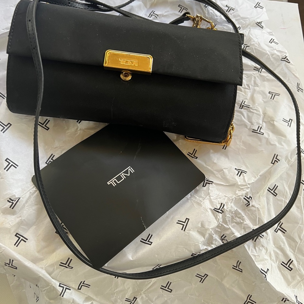 TUMI Black and Gold Clutch